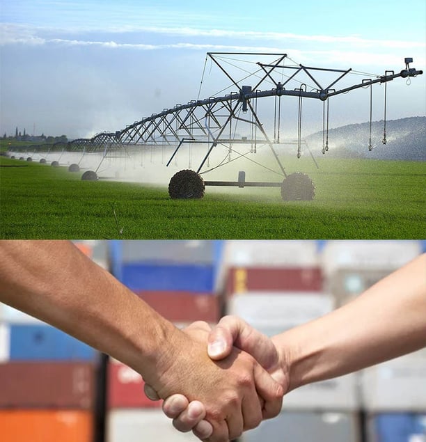 Business handshake in front of crop irrigation